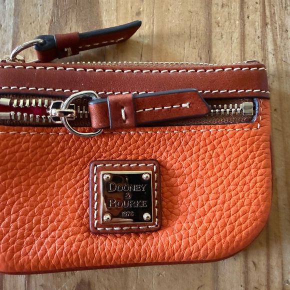 Dooney & Bourke Handbags - Dooney & Bourke Orange Leather Wristlet